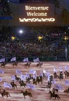 Stockmen on horse form Olympic rings